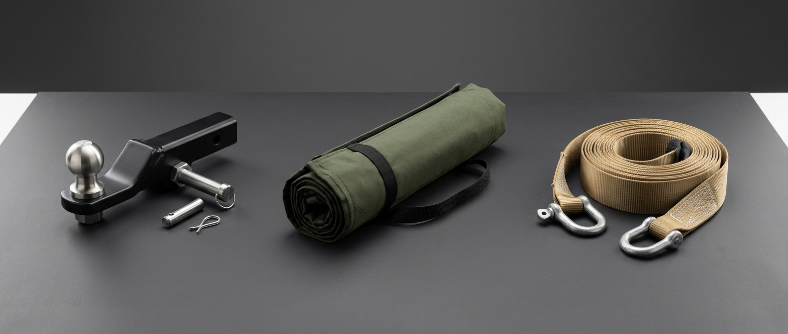 Concept montage of Land Rover Defender tow hitch, awning and recovery equipment — www.defender-accessories.com