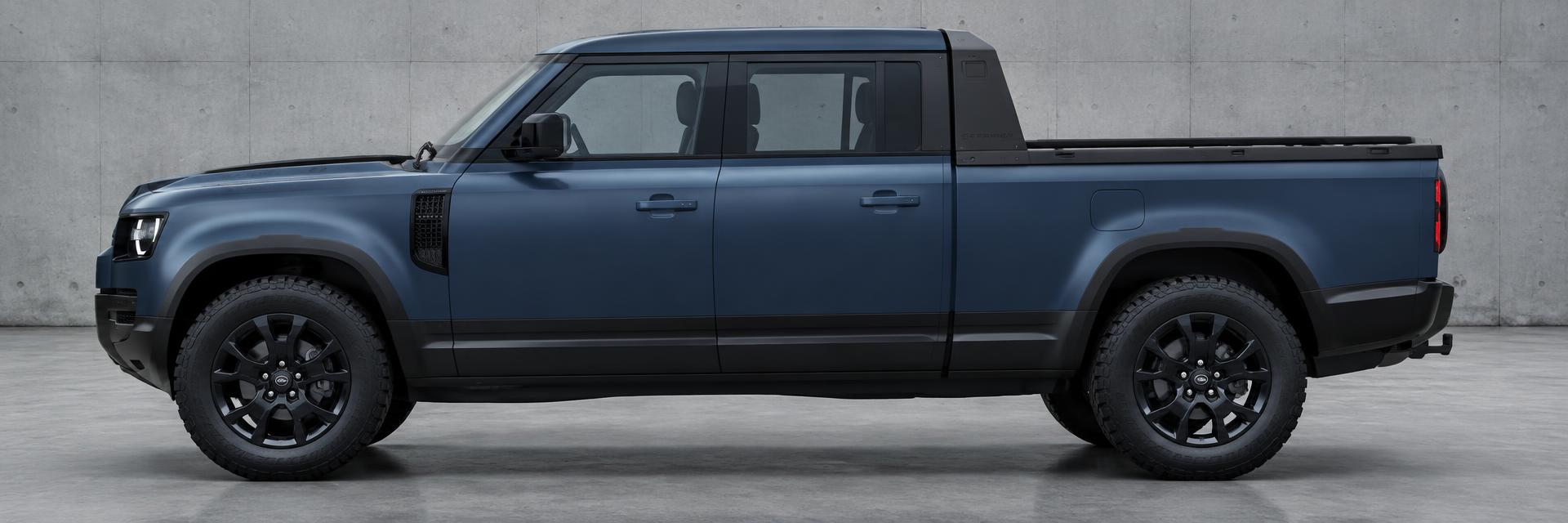 Side profile showing the black cant-rail and sail panel connecting cab to tray on a deep-blue NEW Defender UTE concept on www.defender-accessories.com