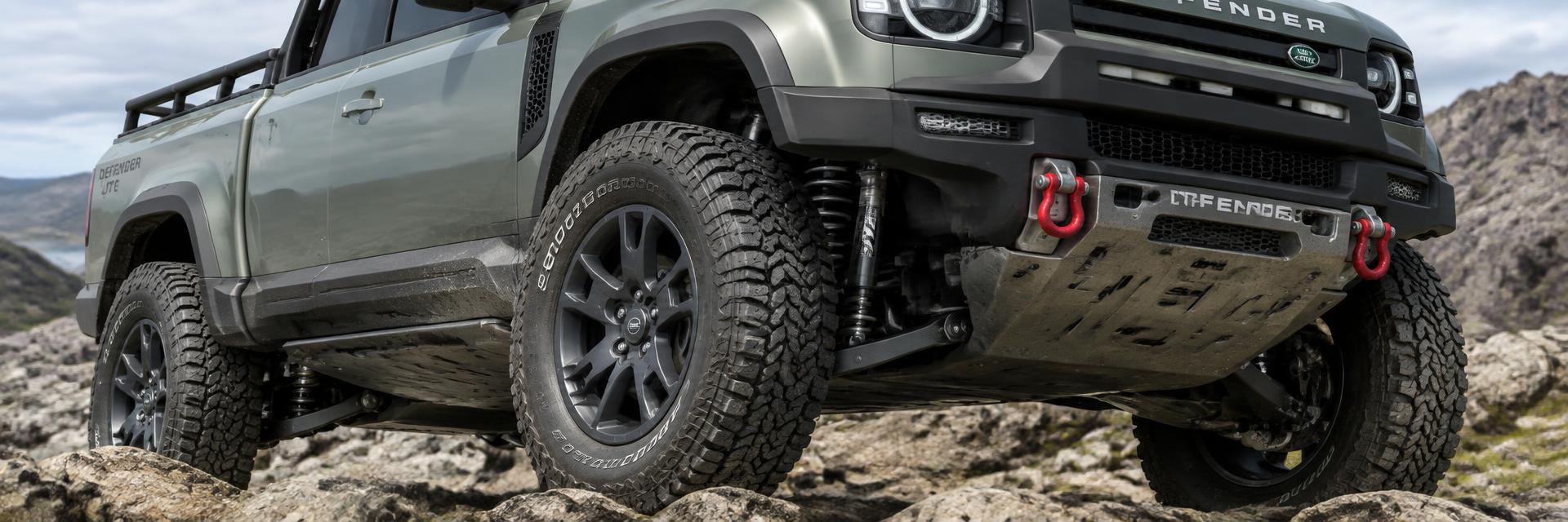 Close-up of suspension, all-terrain tyres, underbody protection and recovery points on a NEW Defender UTE concept on www.defender-accessories.com