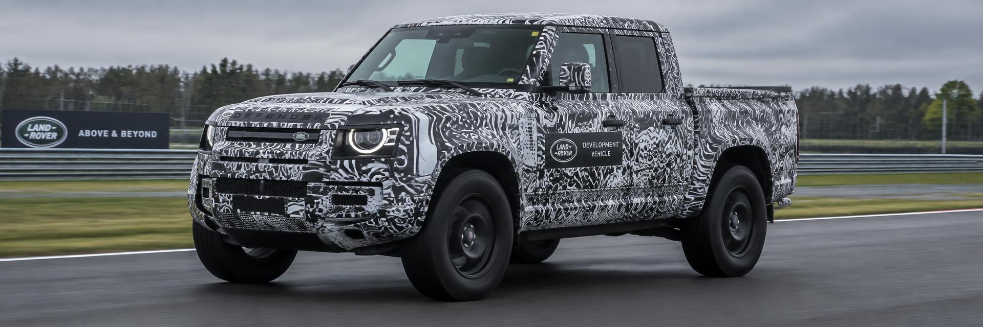 Camouflaged Defender UTE prototype test mule on a closed test track – editorial concept on www.defender-accessories.com